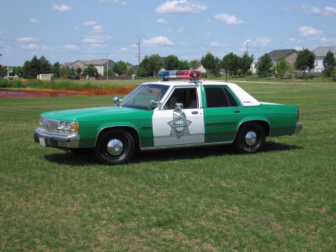 1991 Ford Crown Victoria - This 1991 Ford Crown Victoria police car is marked with a sheriff's star and light bar.
