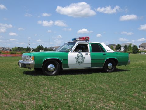 1991 Ford Crown Victoria - This 1991 Ford Crown Victoria is marked as a sheriff's vehicle with a star emblem on the door.