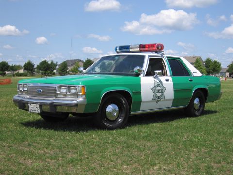 1991 Ford Crown Victoria - This police car appears to be from the 1980s, not a 1991 model.