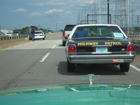1991 Ford Crown Victoria - Highway Patrol Crown Victoria with "OUT OF SERVICE" sticker on rear window.