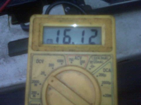 1995 Ford Bronco - A digital multimeter displays a reading of 16.12 volts.