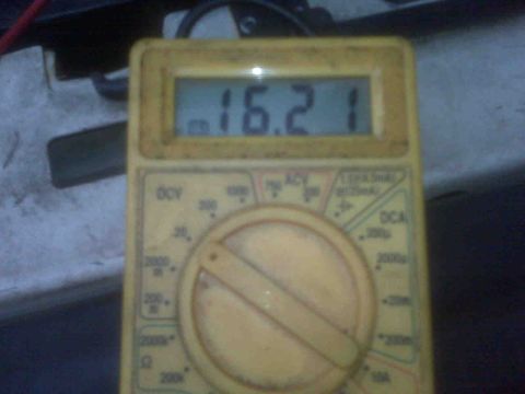 1995 Ford Bronco - A digital multimeter shows a reading of 16.21, indicating a measurement of electrical current or voltage.