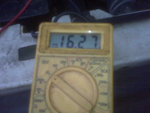 1995 Ford Bronco - A digital multimeter displays a reading of 16.27 volts.