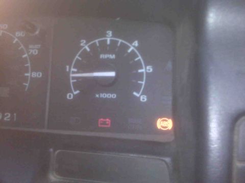 1995 Ford Bronco - Dashboard gauges display RPM and speed, with ABS and battery warning lights active.