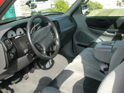 2007 Ford Mustang - Interior view of a 1997 Ford F-150 truck, showing the dashboard, steering wheel, and seats.