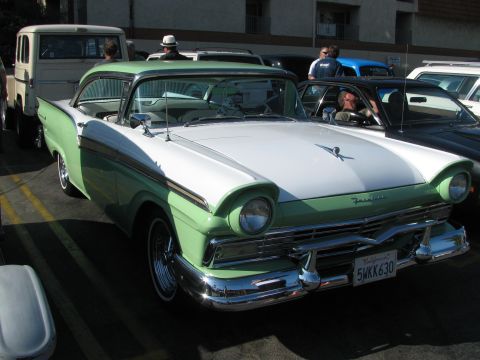 1990 Ford Bronco - green-and-white 1950s two-door hardtop with bold side trim and chrome bumper sits at a car show, California plate 5WKK630.