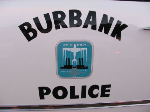 1990 Ford Bronco - Close-up of a Burbank Police door decal featuring the City of Burbank crest on a white car body.