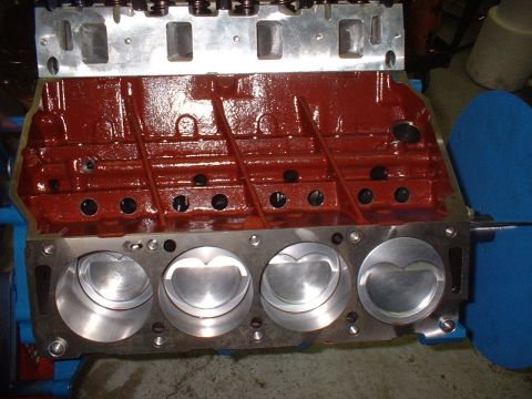 1968 Ford Galaxie - Close-up view of an engine block with pistons and cylinder heads, showing internal engine components.