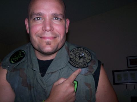 1986 Ford Bronco - A man proudly displays a patch on his tactical vest, indicating membership in a task force.