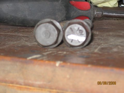 1994 Ford Bronco - Close-up of two bolts and a tool handle, with a date stamp of 08/08/2009.