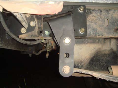 1992 Ford Bronco - A close-up view of a modified suspension part on a vehicle's undercarriage.