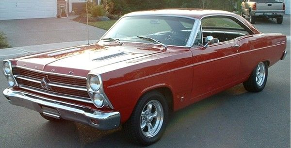 Red 1960s Ford Fairlane GT two-door hardtop in a driveway