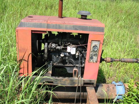 1993 Ford Bronco - Old Bertha. This power unit pulls water outta the lake and puts it in the canal. It's pushing far more water than that little well does.