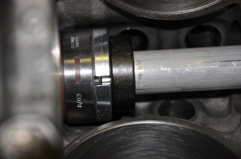 1996 Ford Bronco - Tool with '8/03' and 'CLIMAX SWISS' markings is shown inside an engine cylinder.