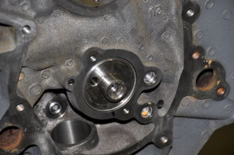 1996 Ford Bronco - Close-up view of an engine block the oil filter housing and associated mounting points.
