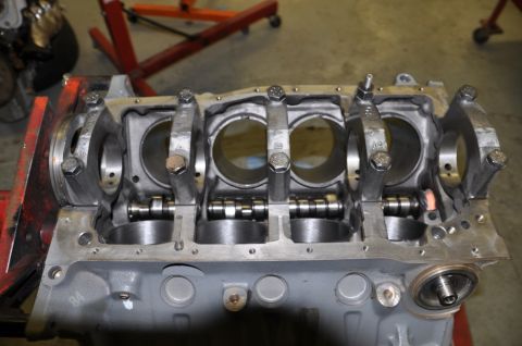 1996 Ford Bronco - Engine block assembly with crankshaft and connecting rods visible, likely undergoing repair or rebuild.
