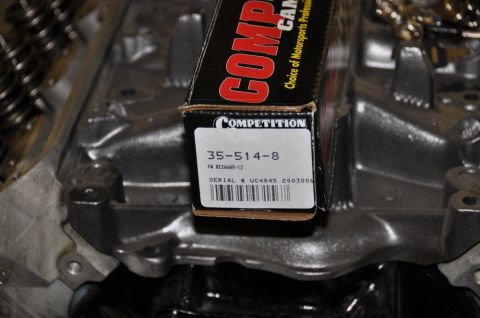 1996 Ford Bronco - Competition Cams box sits on top of an engine block.