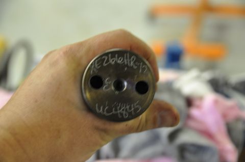 1996 Ford Bronco - Close-up of a metal part with etched identification markings.