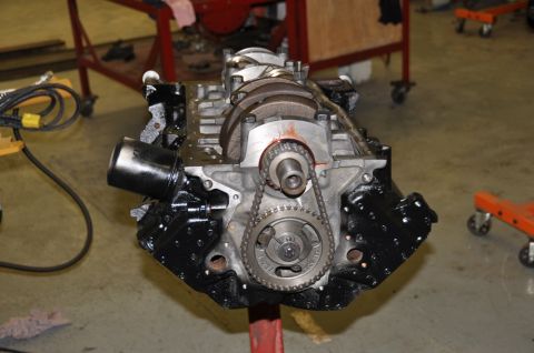 1996 Ford Bronco - Close-up view of an engine block, showing the timing chain and gears, with the crankshaft partially exposed.