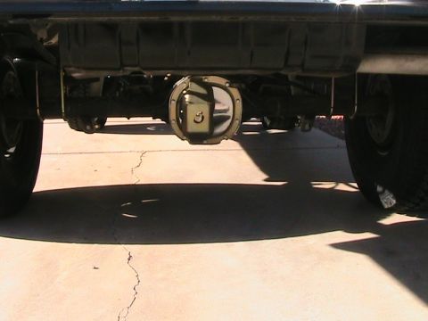 1985 Ford Bronco - Underside view of a vehicle's rear differential and suspension system.