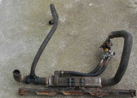 1997 Ford Taurus - Transmission cooler and hoses, likely removed from a vehicle.