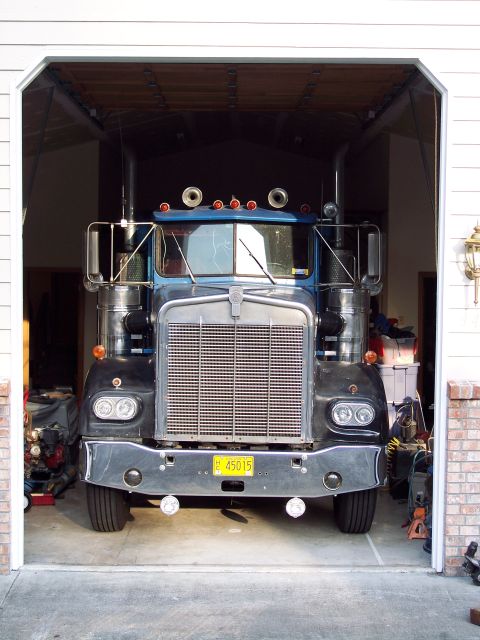 1981 Kenworth W900A - Front view of a 1981 Kenworth W900A semi-truck parked inside a garage.