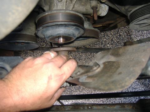 1989 Ford Bronco - Once all the hoses are gone, there's some room to work. Start by taking off the fan. The fan spins, so do your self a favor and leave the s…