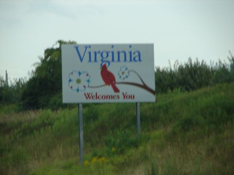 1992 Ford Taurus - A sign welcomes visitors to Virginia, a cardinal on a branch.