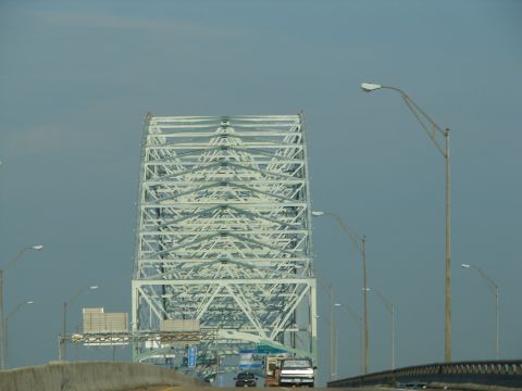 1992 Ford Taurus - View of a large truss bridge from the highway, with multiple vehicles on the road.