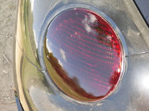 1999 Volkswagen Beetle - A close-up view of a vehicle's red taillight assembly.