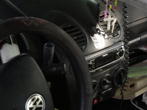 1999 Volkswagen Beetle - Interior view of a 1999 Volkswagen Beetle, showing the dashboard and steering wheel.