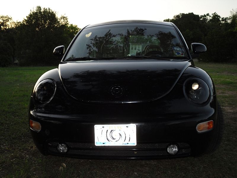Black Volkswagen Beetle front view with Texas license plate