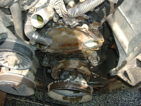 1989 Ford Bronco - Old pump gone. Nice mess... Time to clean up. Everything. Get the scraper and razor blades to remove the old gasket on the mounting block.…