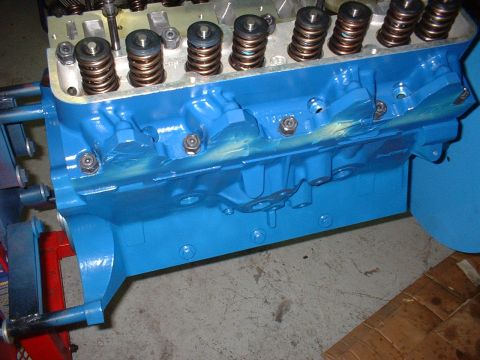 1968 Ford Galaxie - Close-up of a freshly painted blue engine block, showing valve springs and mechanical components.