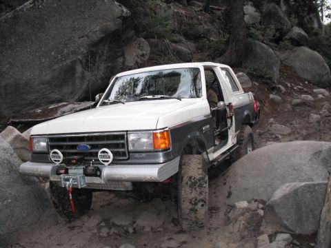 1991 Ford Bronco - This 1991 Ford Bronco is shown off-roading on a challenging rocky path.