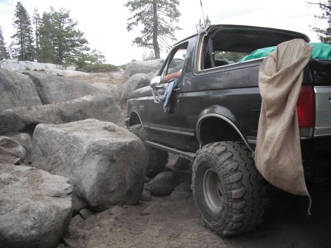 1991 Ford Bronco - This Ford Bronco appears to be from the early 1990s, not a 1991 model, as it navigates a rocky off-road course.