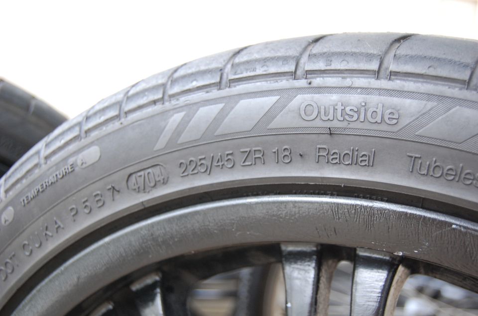 Tire sidewall reading 225/45 ZR 18 Radial Tubeless with DOT code 4704