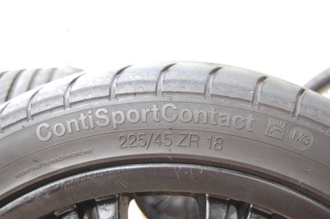 2002 BMW M3 - Close-up of a tire showing brand and size information, with a visible M3 marking.
