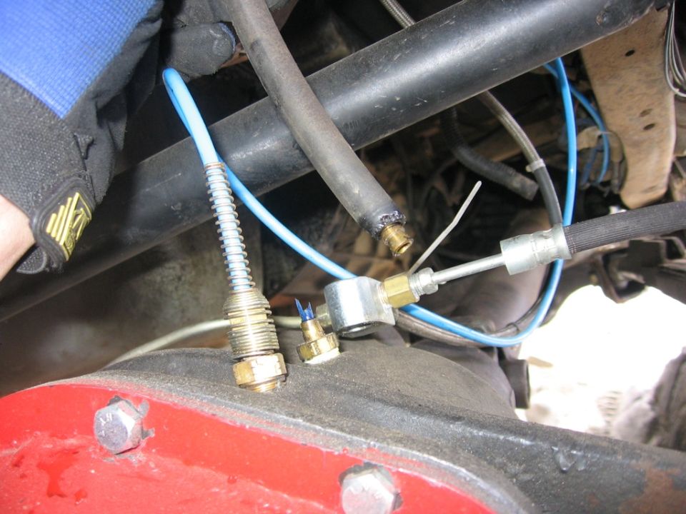 1989 Ford Bronco rear differential with brake lines and a blue air line attached