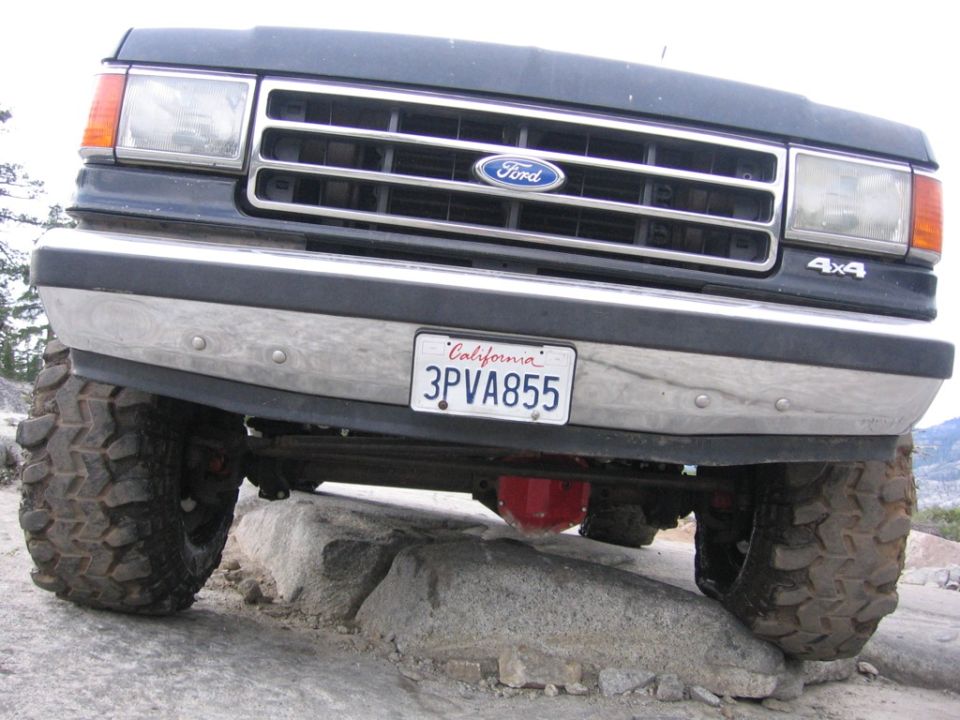 Ford Bronco on rocks, front view. California license plate 3PVA855