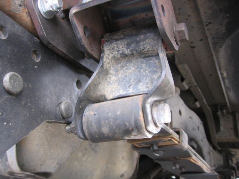 1989 Ford Bronco - Underside view of a vehicle's leaf spring suspension component.