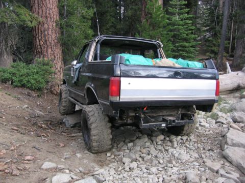 1989 Ford Bronco - This black Ford Bronco is equipped for off-road use with a lifted suspension and large tires.