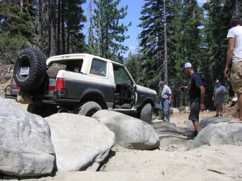 1989 Ford Bronco - Off-roading adventure in a 1989 Ford Bronco on a challenging rocky path.