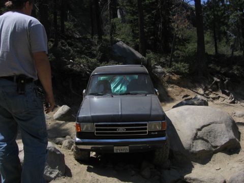 1989 Ford Bronco - Ford Bronco on a rocky trail, possibly a 1987 model based on grille design.