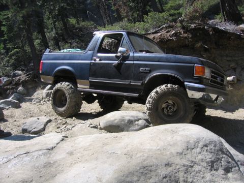1989 Ford Bronco - This 1989 Ford Bronco is tackling a challenging rocky off-road course.