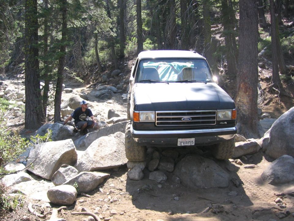 Black 1989 Ford Bronco on a rocky trail