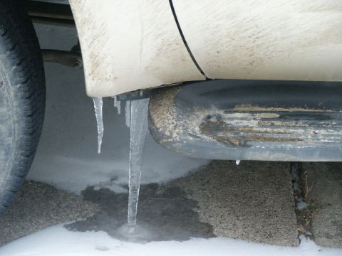 2000 Ford F-250 - Icicles formed on the running board of a vehicle during winter weather.