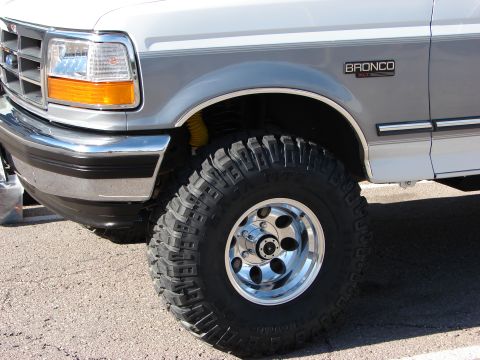 1995 Ford Bronco - Close-up of the front fender and aggressive tire on a 1995 Ford Bronco.