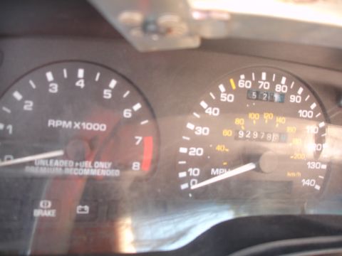 1993 Ford Taurus - Interior view of a car's dashboard gauges, including a speedometer and tachometer.