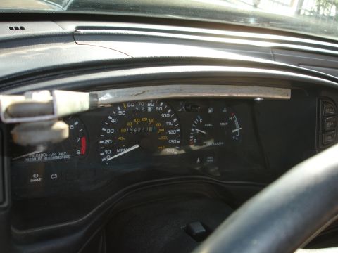 1993 Ford Taurus - The interior dashboard of a 1993 Ford Taurus shows the speedometer, fuel gauge, and temperature gauge.